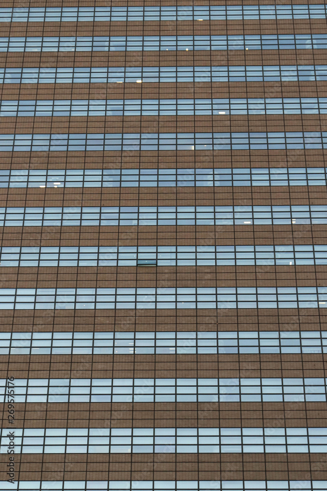 Solid background of the window of a large building on a flat wal Solid background of the window of a large building on a flat wal