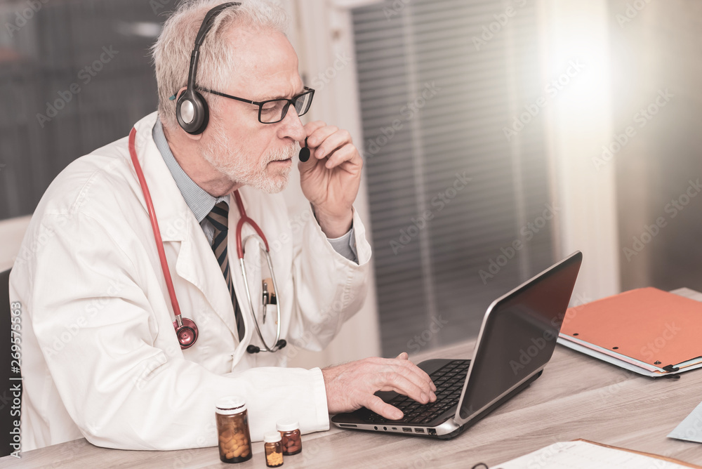 Portrait of doctor during online medical consultation Portrait of doctor during online medical consultation