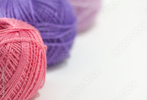 Pink thread close-up. Violet and pink shades. 