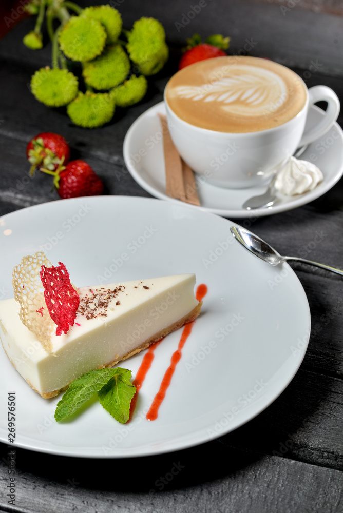 cake with strawberries and cup of coffee cake with strawberries and cup of coffee