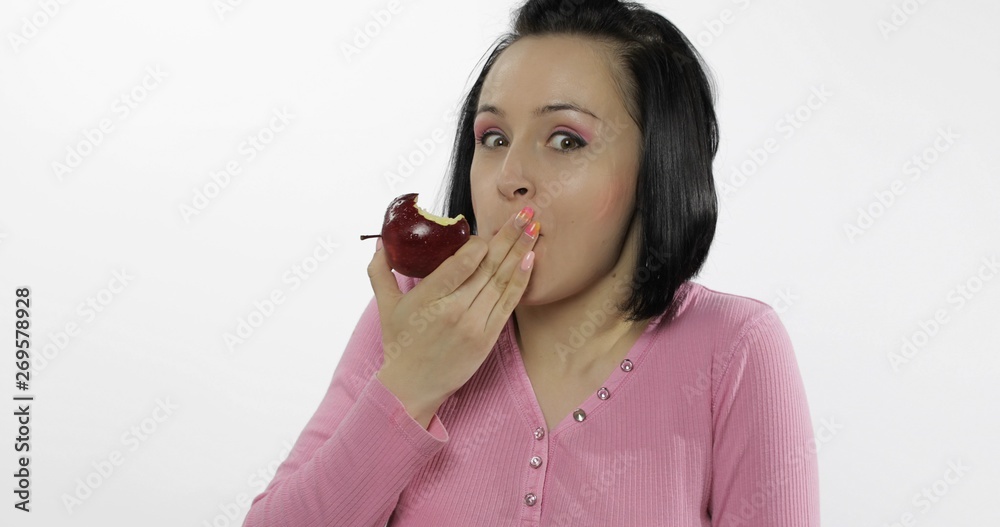 Young beautiful eating red apple. Healthy nutrition Young beautiful eating red apple. Healthy nutrition