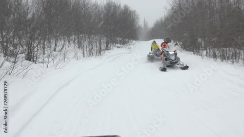 Wallpaper Mural snowmobile drivers move in line along narrow hilly track Torontodigital.ca