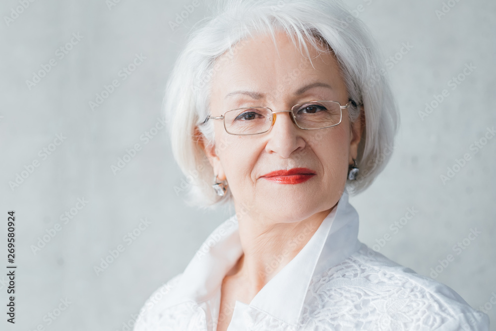 Arrogant senior lady portrait. Confidence control resolution. Dignified elegant aged business female looking at camera.