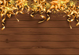 Festive background with golden ribbons and confetti on dark wood textured background. Place for text. Great for greetings, party invitation, New year and Christmas cards, banner, headers, poster, web.