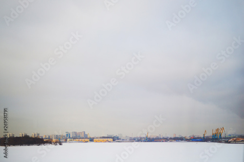 winter background on the city from the river, snowdrifts © Dikkens