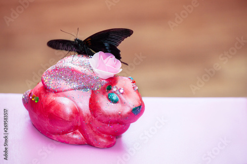 ceramic pink bunny butterfly incept  photo