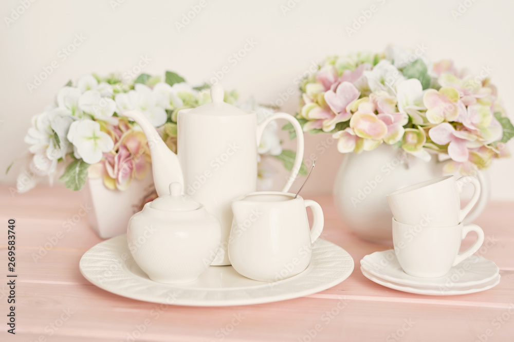 tea and coffee set on the table on a white background tea and coffee set on the table on a white background