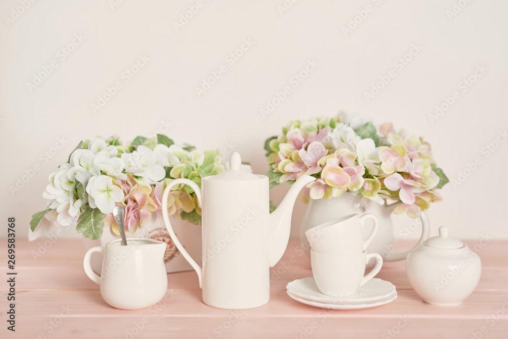 tea and coffee set on the table on a white background tea and coffee set on the table on a white background