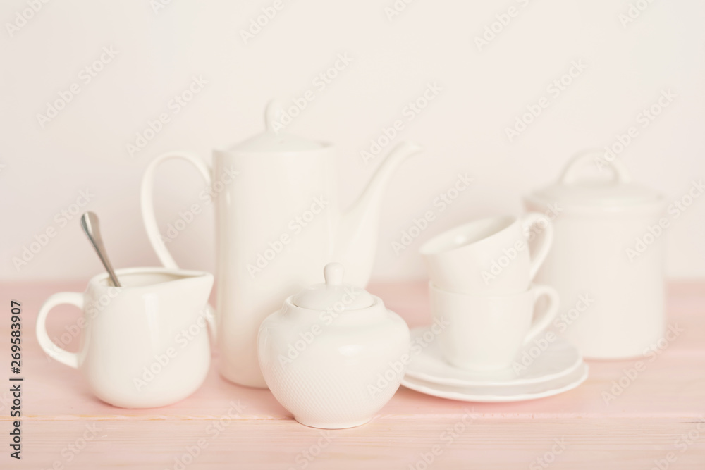 tea and coffee set on the table on a white background tea and coffee set on the table on a white background