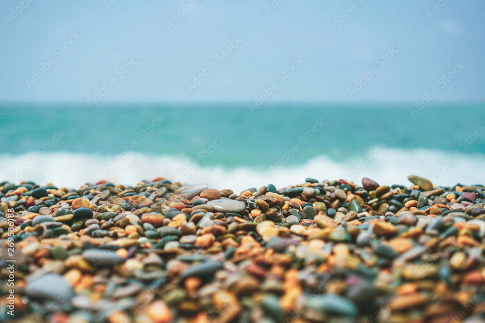 Pebble beach and blue sky on background Pebble beach and blue sky on background