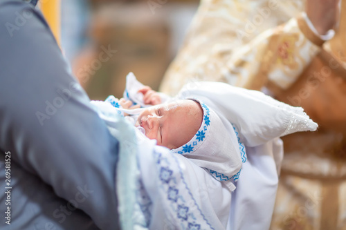 baptism of a child in the Church, the process of anointing, baptism Christening the baby at the Orthodox church