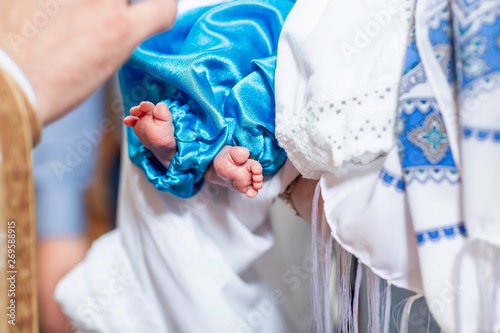 Infant baptism. baby preparing for a baptismal ceremony, The sacrament of baptism. Attributes of an Orthodox priest for baptism