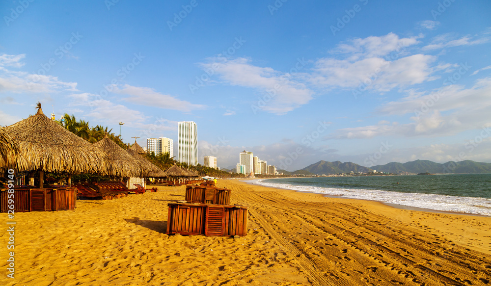 Deckchairs, umbrella and chair, parasol on the tropical sand beach