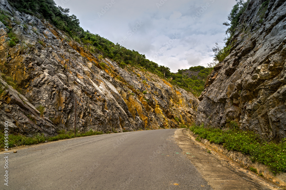 asphalt road mountains highlighted limestone formations