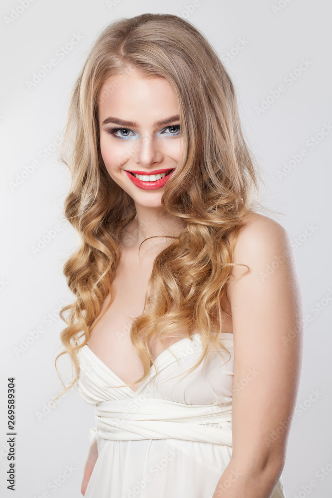 Portrait of cute blonde woman. Pretty girl with long curly hair smiling Portrait of cute blonde woman. Pretty girl with long curly hair smiling