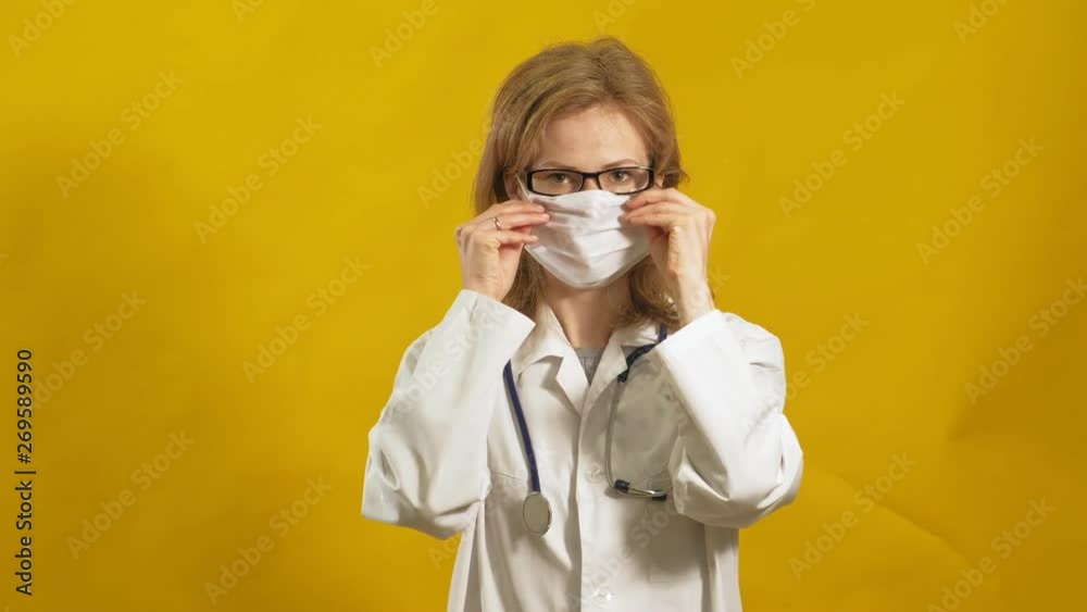 Young woman doctor. Yellow background. The concept of medicine. Young woman doctor. Yellow background. The concept of medicine.