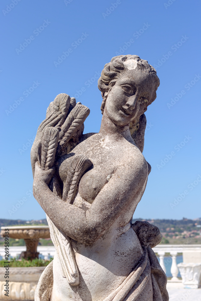 Sculpture of a girl with spikelets