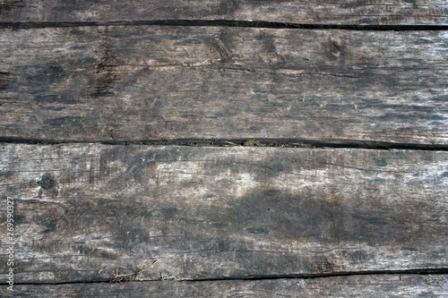 The wall of old boards natural wood. Pattern natural tree texture. The natural surface of the wooden wall cladding