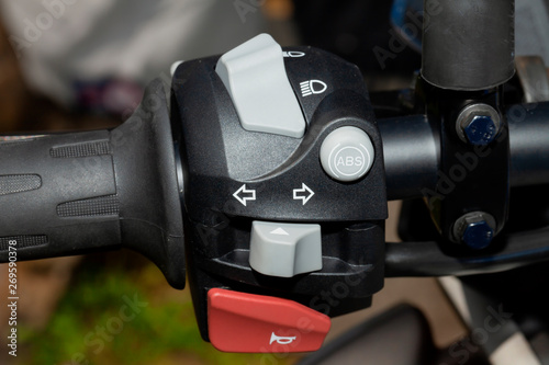 Detail of the controls on the handlebar of a motorcycle