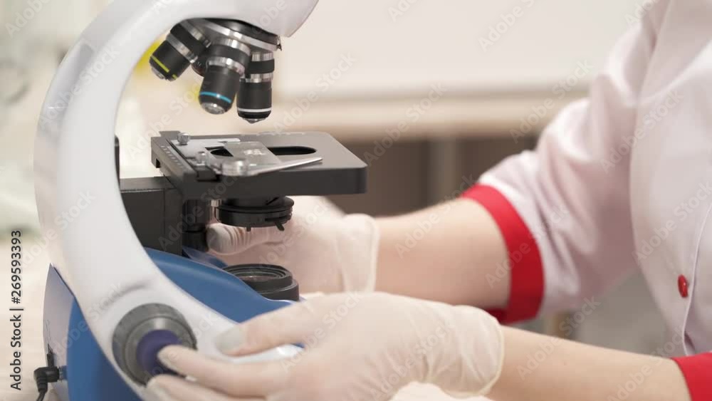 Medical laboratory, scientist using microscope for chemistry ,biology test samples, examining liquids. Professional equipment. Scientific and healthcare research concept Medical laboratory, scientist using microscope for chemistry ,biology test samples, examining liquids. Professional equipment. Scientific and healthcare research concept