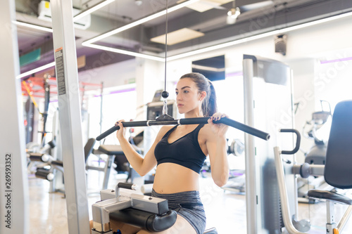 Sporty Woman Exercising At A Modern Gym