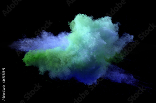 Collision of colored powder isolated on black