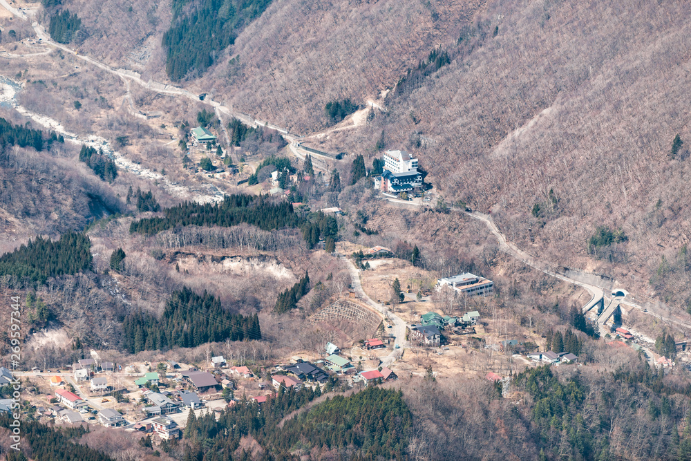 Takayama, Japan in Shinhotaka Ropeway in Gifu Prefecture mountain park on spring day with high angle aerial view of village