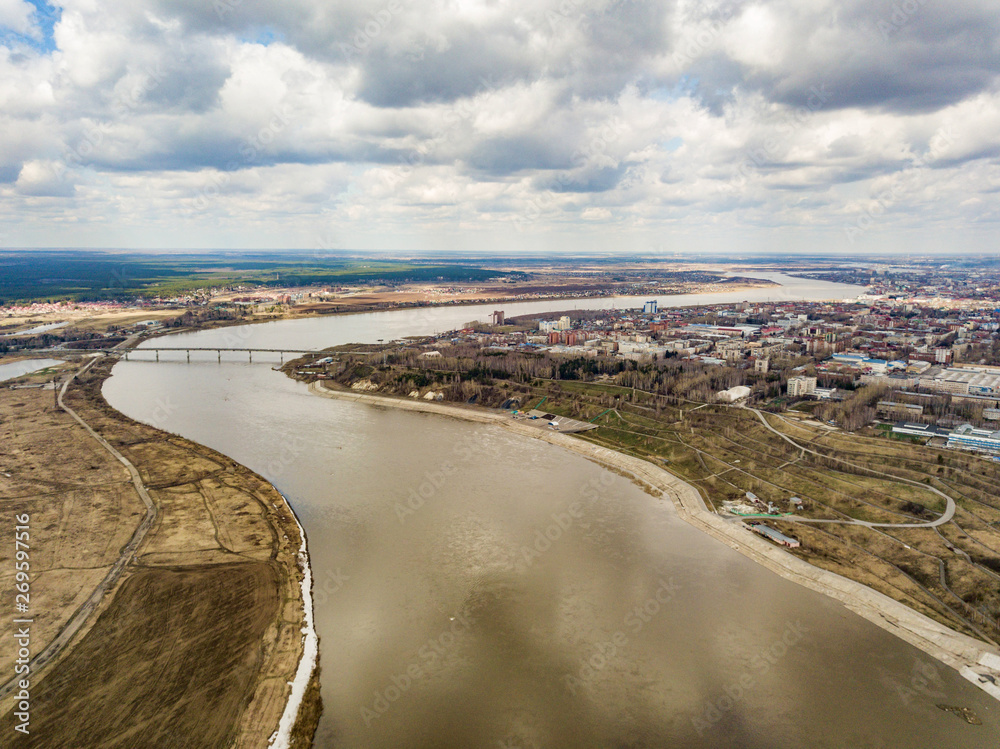 Aerial view of Tom river and Tomsk City. Early spring in Siberia. Russia.