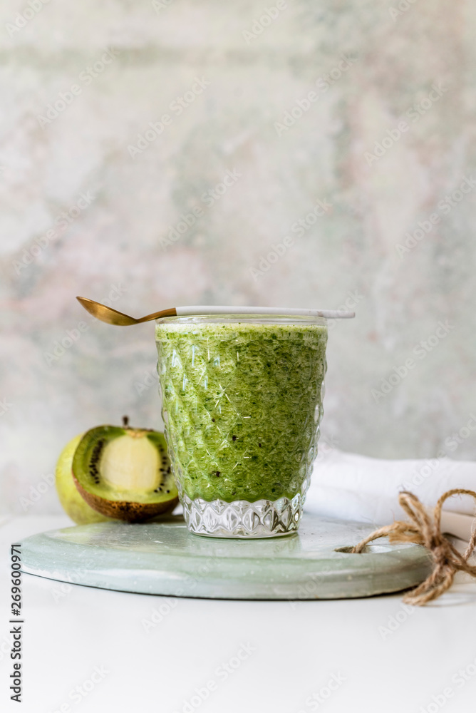 Healthy green smoothie of spinach, avocado and kiwi apple with lemon juice. Super food, detox and healthy food. Healthy green smoothie of spinach, avocado and kiwi apple with lemon juice. Super food, detox and healthy food.