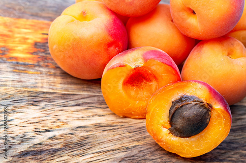 Set of apricots on a cutting wood. photo