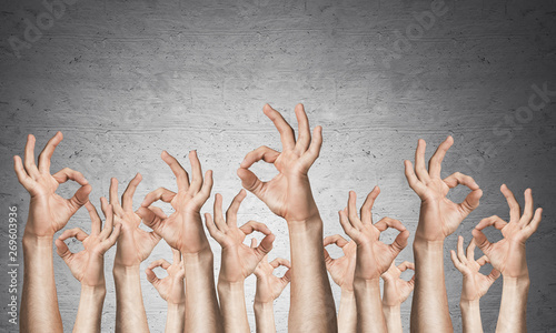 Row of man hands showing okay gesture