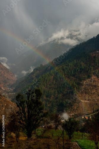 Colorful landscape with Rainbow in high Himalayan mountains,