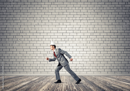 King businessman in elegant suit running in empty room