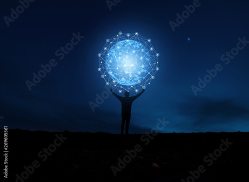  concept global network connection in hands on night sky background .soft focus picture .Blue tone concept