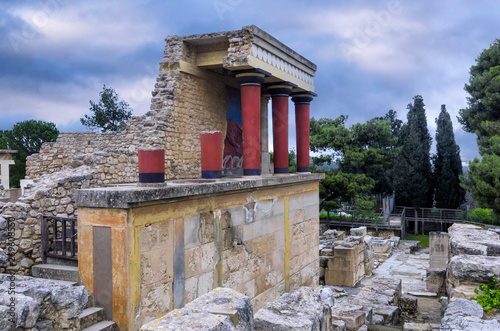 Knossos Palace, Crete / Greece. Restored North Entrance with charging bull fresco at the famous archaeological site of Knossos. Sunset, cloudy sky