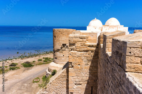 Side of the Borj el Kebir Castle with Mediterranean Sea in Houmt El Souk in Djerba, Tunisia