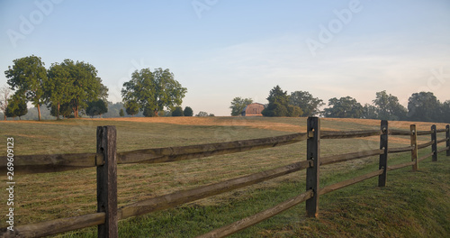  Bailing Hay Today  a field of freshly cut hay at dawn with wooden fence Zen Duder Americana Fences Collection