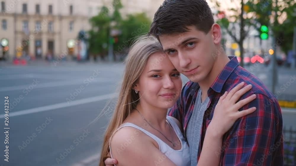 Love and relationship. Young couple hugging in the street. Urban leisure Love and relationship. Young couple hugging in the street. Urban leisure