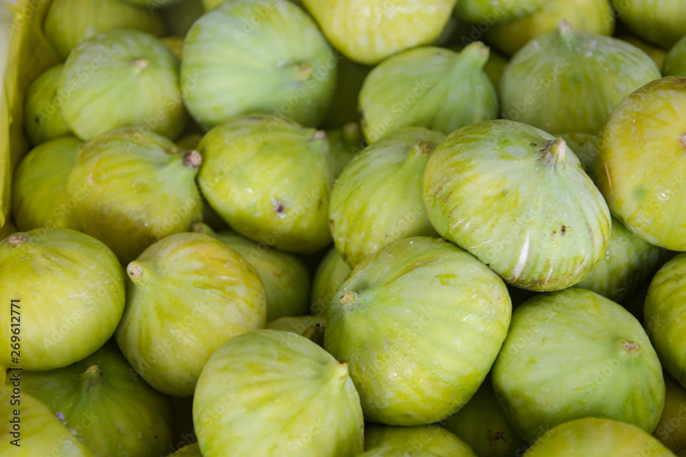 green figs scattered on the surface green figs scattered on the surface