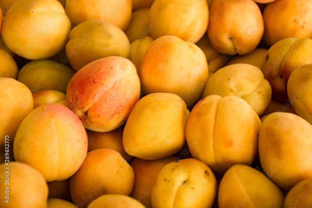ripe apricot fruits scattered on the surface ripe apricot fruits scattered on the surface