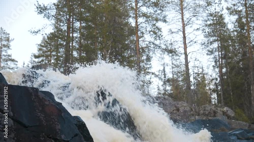 Static shot of the top of the Hepokongas waterfall, on a sunny day, in Puolanka, Kainuu region,  Finland 50fps photo