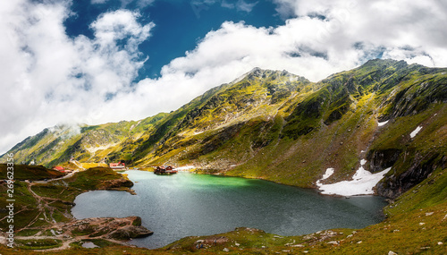 amazing mountain scenery. lake in mountains with clouds reflecte
