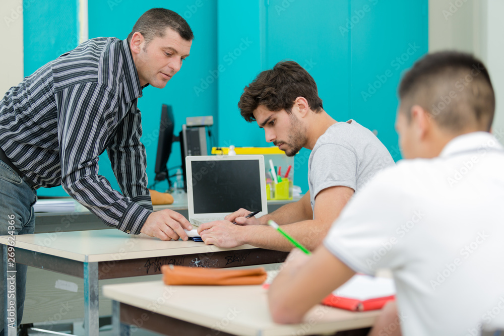university teacher with students in class university teacher with students in class