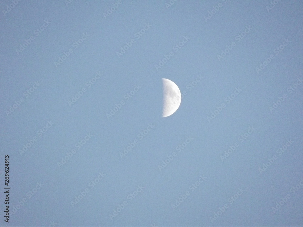 half moon in the sky in the evening half moon in the sky in the evening