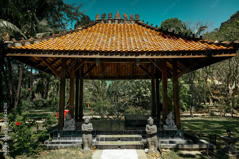 Antique gazebo pavilion with a roof asian style pagoda. In a summer ...