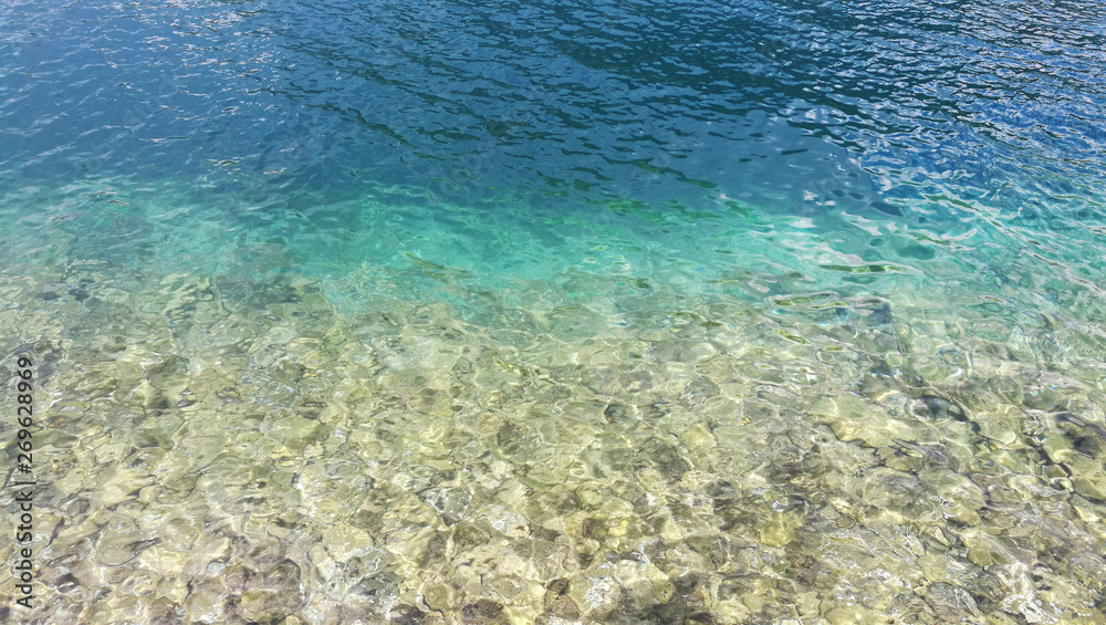 background azure sea and rocky bottom