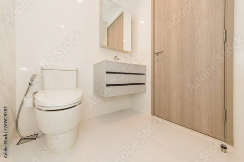 Toilet bowl in modern bathroom interior