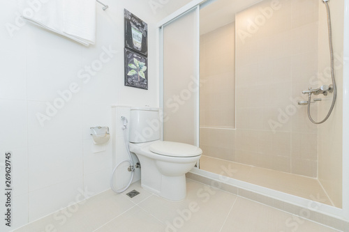 Toilet bowl in modern bathroom interior