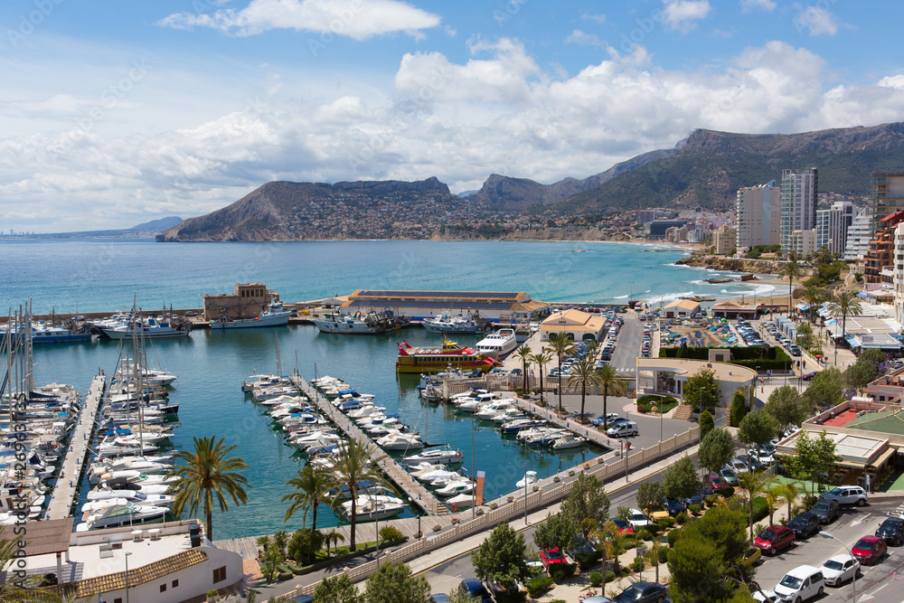 Calp Spain marina and yachts and boats also known for the famous rock landmark Penon de Ilfach