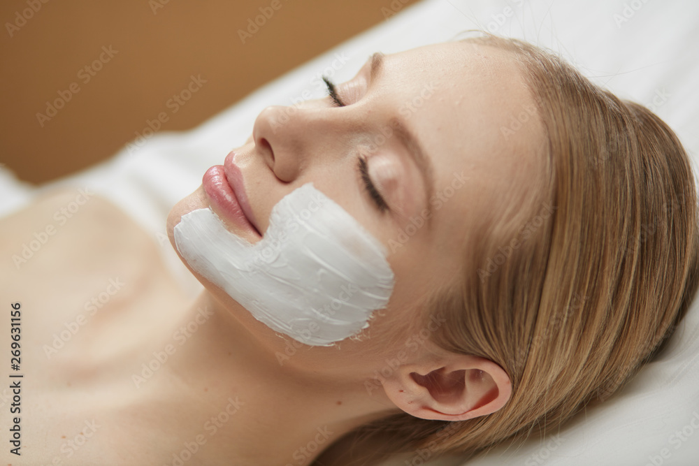 Beautiful young woman in cosmetic salon close up Beautiful young woman in cosmetic salon close up